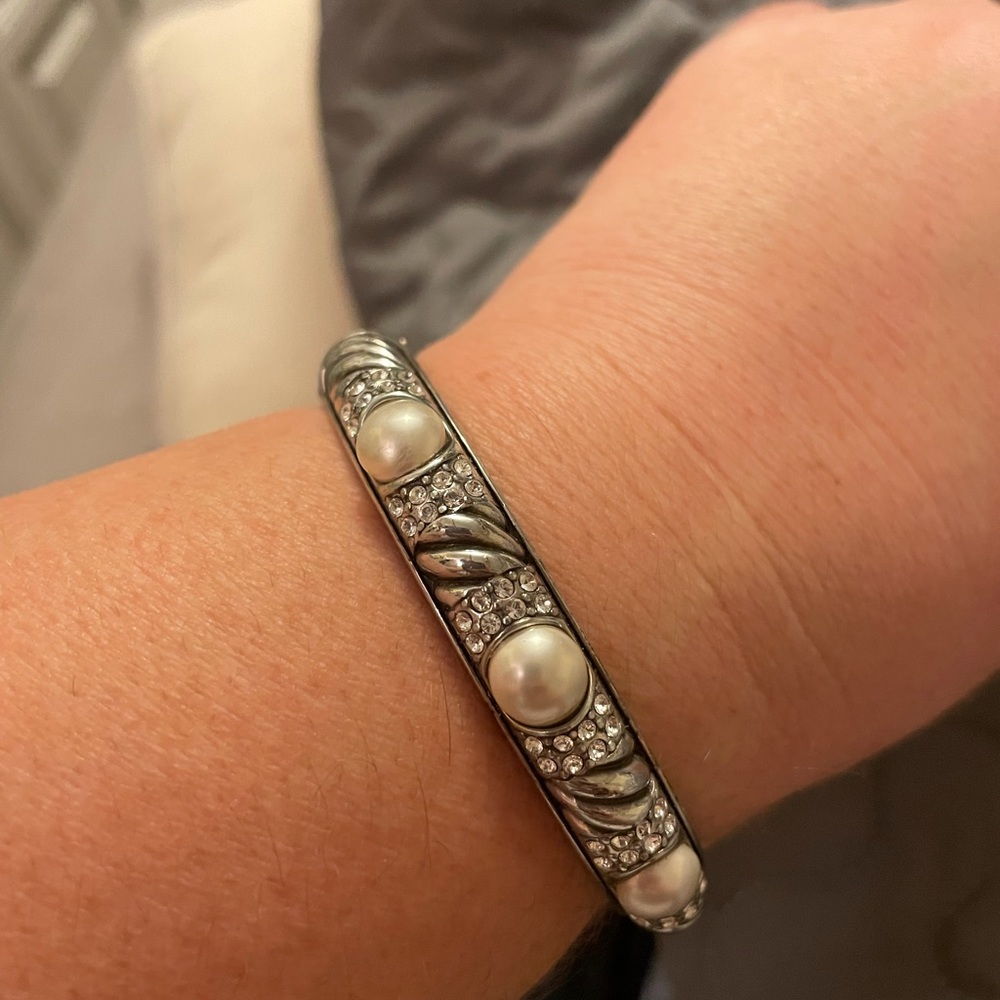 Brighton clasp bangle with decorative faux pearls and faux diamond accents